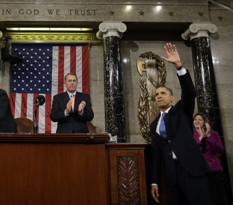 FILE - In this Feb. 12, 2013, file photo, President Barack Obama waves and House Speaker John Boehner of Ohio applauds after the president gave his State of the Union address during a joint session of Congress on Capitol Hill in Washington. (AP Photo/Charles Dharapak, Pool)