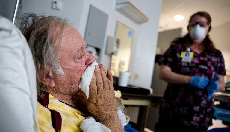 Henry Beverly, 73, battles the flu while tended to by nurse Kathleen Burks at Upson Regional Medical Center in Thomaston, Ga., Friday, Feb. 9, 2018. "I believe if I stand up right now I'd just collapse," said Beverly after days of battling the flu. Beverly came to the emergency room earlier in the week and was scheduled to go home after being treated before his symptoms took a quick turn for the worse. "I felt like my body was just going to blow up. A lot of people don't realize what the flu really is. It takes a lot to put me on my feet. I believe I would have died if I went home."