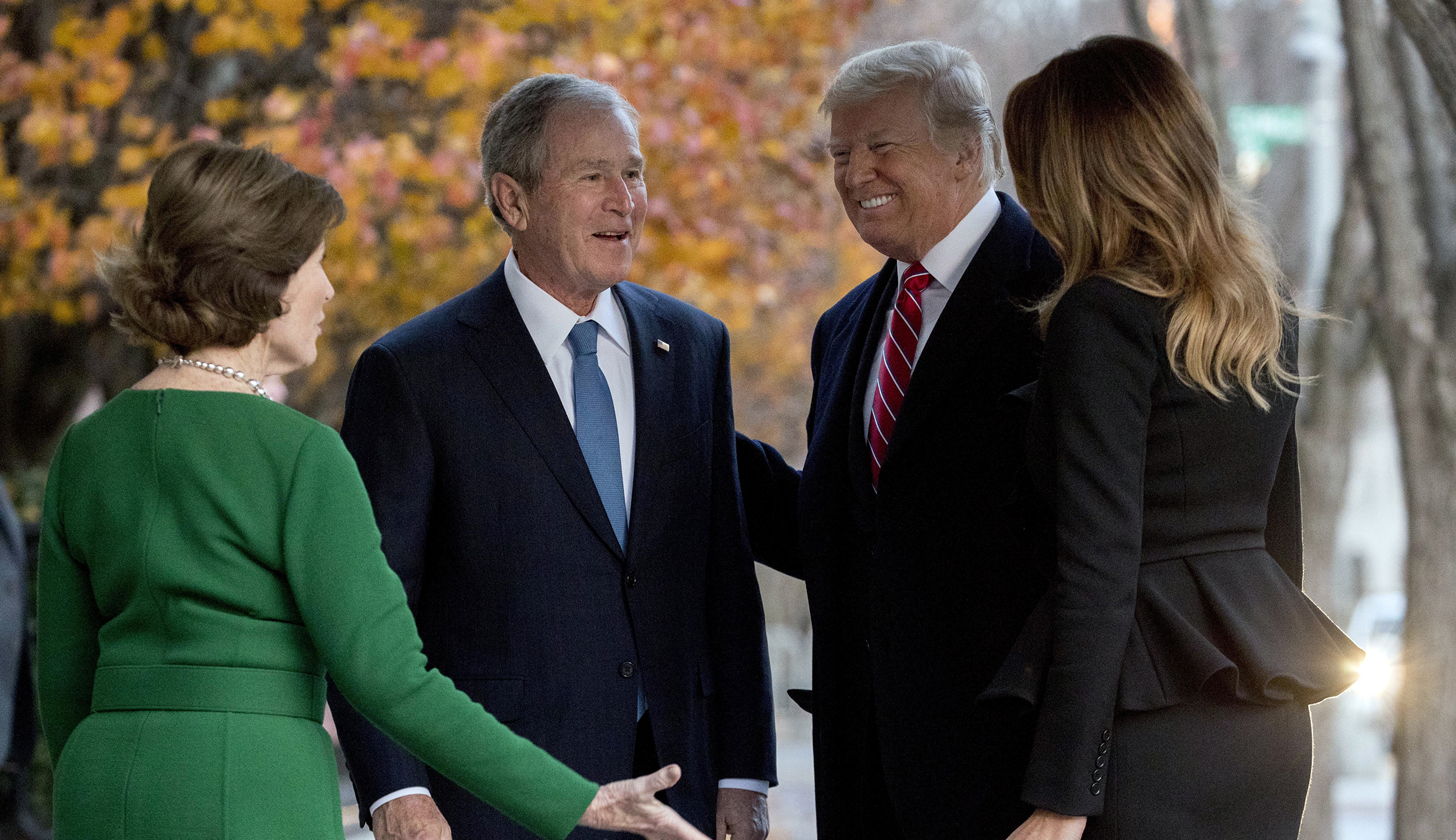 Bush family welcomes Trump, in marked departure from McCain funeral