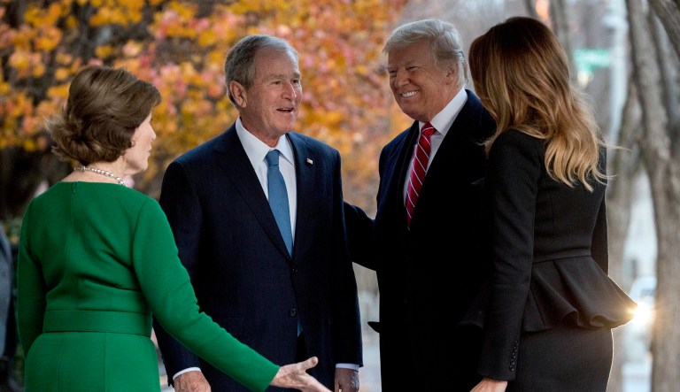 President Donald Trump and first lady Melania Trump are greeted by former President George Bush and former first lady Laura Bush outside the Blair House across the street from the White House in Washington, Tuesday, Dec. 4, 2018.