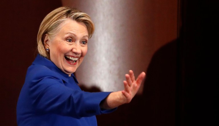 Former Secretary of State Hillary Clinton waves to well-wishers following an appearance at Barnard College with New York Governor Andrew Cuomo, Monday, Jan. 7, 2019, in New York, where the pair called for codifying abortion rights into New York State law. The two Democrats shared the stage Monday where members of the state Legislature and women's rights advocates cheered Clinton as she said the struggle for women's equality "continues to be the fight of our lifetime."