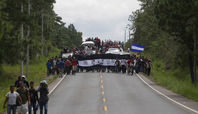 Hondurans march in a caravan of migrants moving toward the country's border with Guatemala in a desperate attempt to flee poverty and seek new lives in the United States, in Ocotepeque, Honduras, Monday, Oct. 15, 2018. The group has grown to an estimated 1,600 people from an initial 160 who first gathered early Friday in a northern Honduras city. They plan to try to enter Guatemala on Monday. 