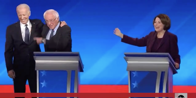 Biden hugs Bernie Sanders at New Hampshire debate