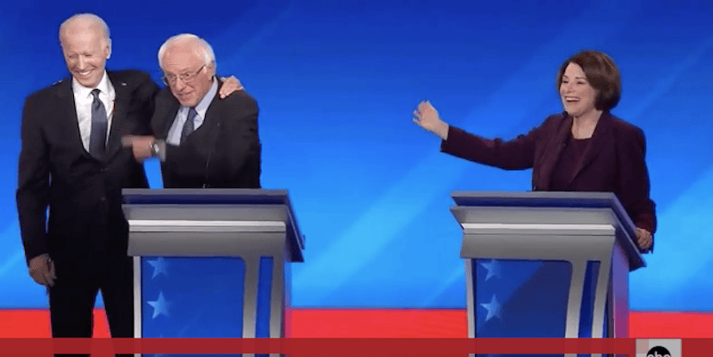Biden hugs Bernie Sanders at New Hampshire debate