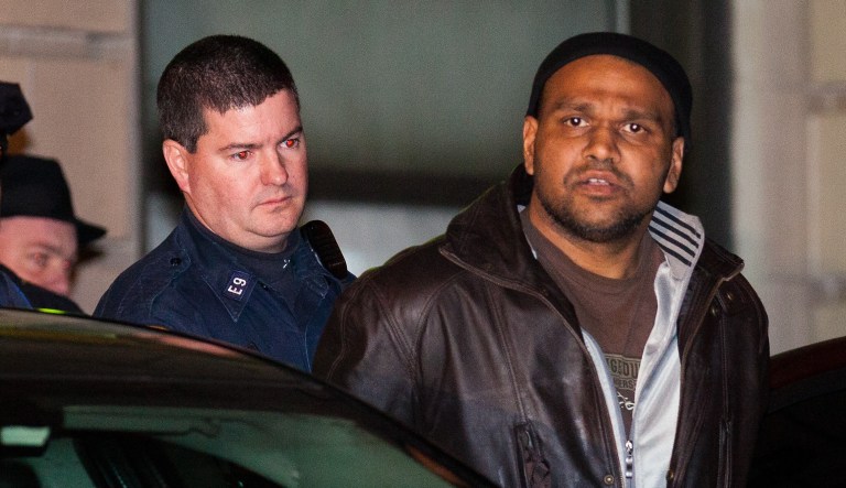 Ray Lazier Lengend, accused of hurling crude Molotov cocktails at an Islamic cultural center and four other New York-area sites on New Year's Day, is led by police, Tuesday, Jan. 3, 2012, in the Queens borough of New York.