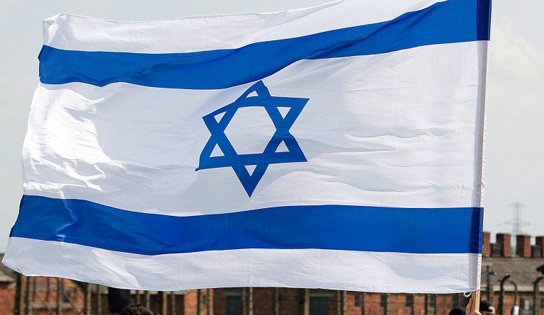 Young Jews from around the world walk with Israeli flags through the former Nazi German death camp of Birkenau during the annual Holocaust remembrance event, the âMarch of the Livingâ in memory of  the six million Holocaust victims  in Oswiecim, Poland, Thursday, May 2, 2019.