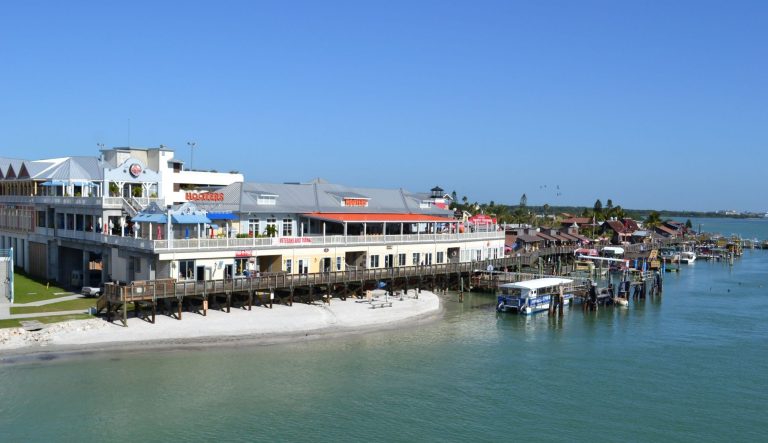 In this Nov. 7, 2011, photo, a new section completed in 2008 and old section started in the 1980s of John's Pass Village Boardwalk in Madeira Beach, Fla., is shown.