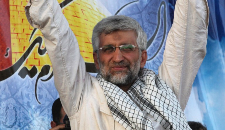 Iranian presidential candidate Saeed Jalili, who is also Iran's top nuclear negotiator, waves to his supporters, in a campaign rally, two days prior to the election, in Tehran, Iran, Wednesday, June 12, 2013.