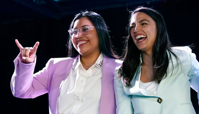 Rep. Alexandria Ocasio-Cortez, right, attends a rally with Democratic Congressional candidate Jessica Cisneros.