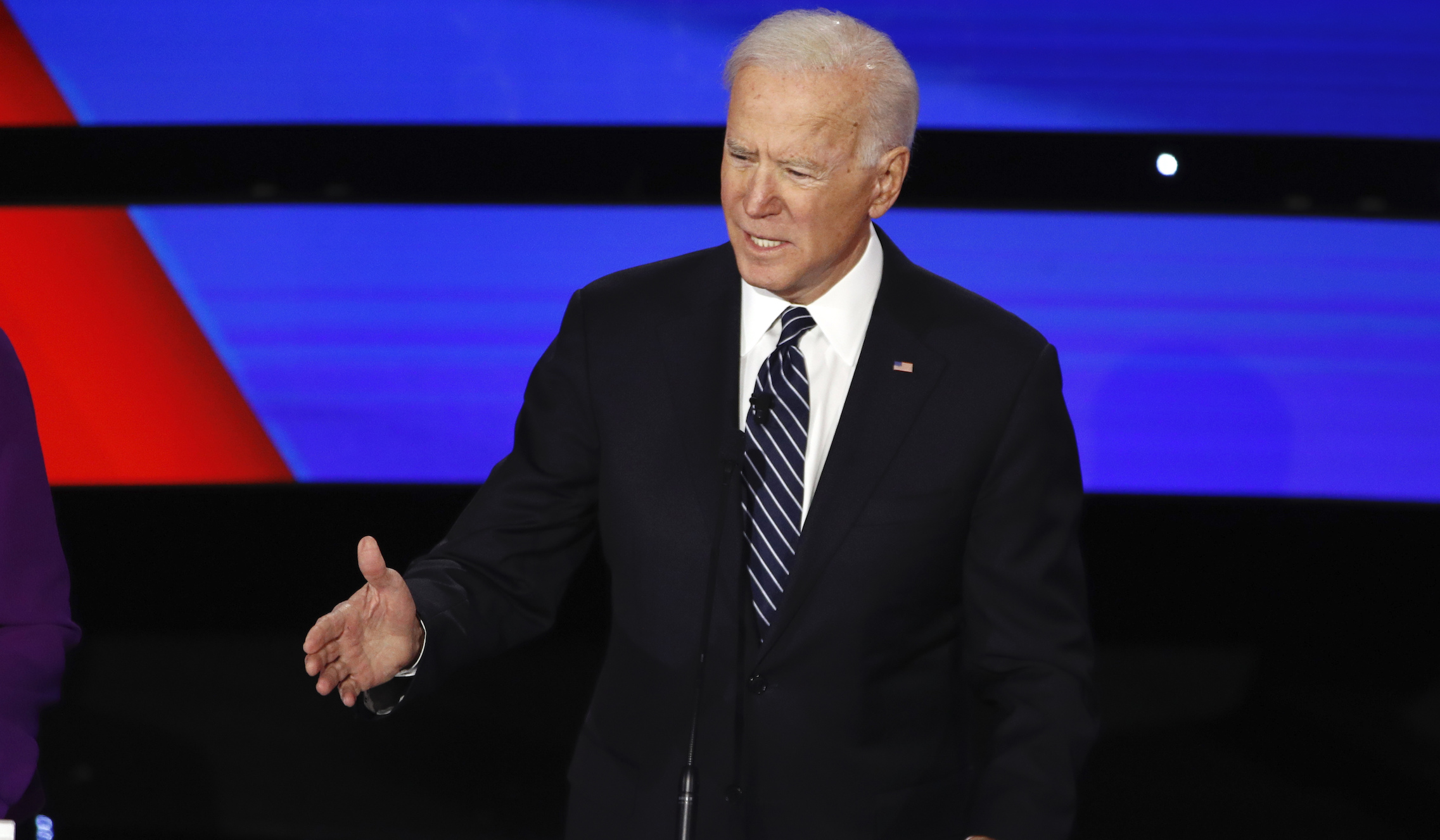 Biden coughs into hand while answering first debate question on coronavirus