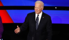 Biden coughs into hand while answering first debate question on coronavirus