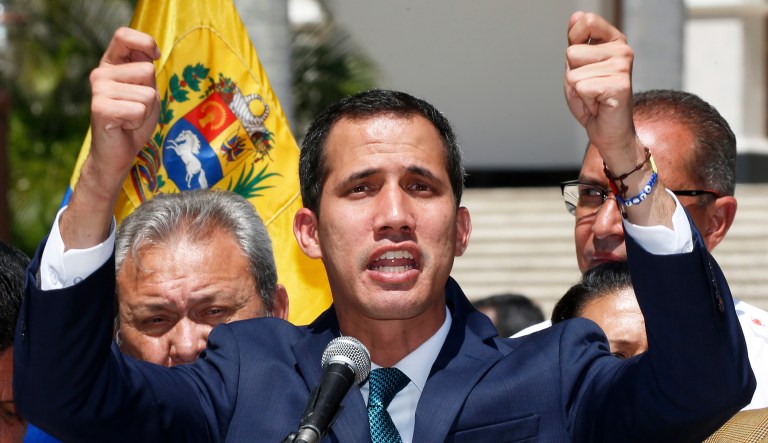 Opposition leader Juan Guaido, who has declared himself the interim president of Venezuela, speaks during a press conference on the steps of the National Assembly in Caracas, Venezuela, Monday, Feb. 4, 2019. 