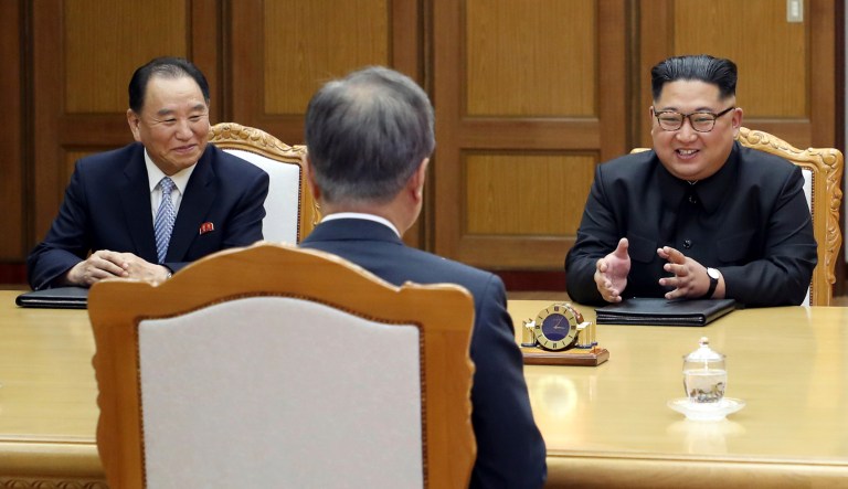 In this May 26, 2018 photo provided on May 27, 2018, by South Korea Presidential Blue House, North Korean leader Kim Jong Un, right, talks with South Korean President Moon Jae-in, center, during a meeting at the northern side of Panmunjom in North Korea. Kim and Moon met Saturday, May 26 for the second time in a month, exchanging a huge bear hug and broad smiles in a surprise summit at a border village to discuss Kim's potential meeting with U.S. President Donald Trump and ways to follow through on the peace initiatives of the rivals' earlier summit. At left is Kim Yong Chol, a former military intelligence chief who is now a vice chairman of the North Korean ruling party's Central Committee tasked with inter-Korean relations.