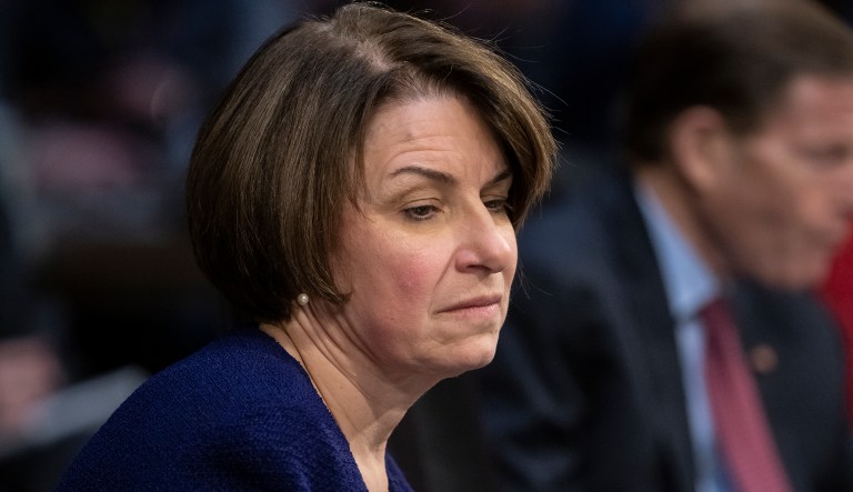 Senate Judiciary Committee member Sen. Amy Klobuchar, D-Minn., prepares to vote against advancing William Barr's nomination for attorney general, as the panel meets on Capitol Hill in Washington, Thursday, Feb. 7, 2019.