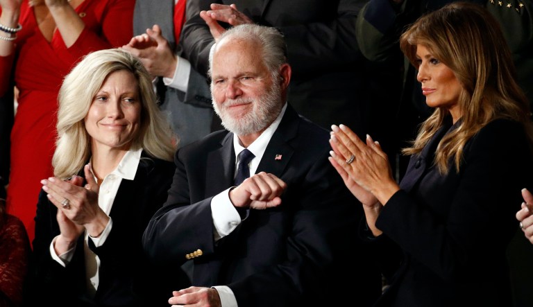 In this Feb. 4, 2020 file photo, Rush Limbaugh reacts as first Lady Melania Trump, and his wife Kathryn, applaud, as President Donald Trump delivers his State of the Union address to a joint session of Congress on Capitol Hill in Washington.  Limbaugh, the talk radio host who became the voice of American conservatism, has died.