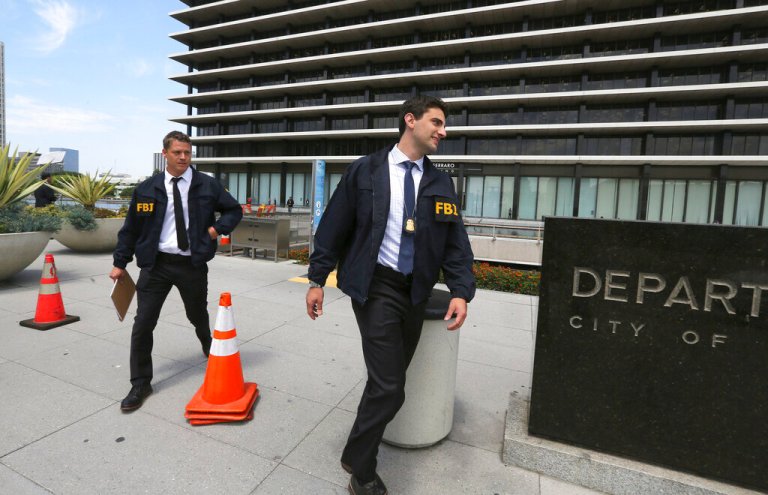 FBI agents leave the headquarters of the Los Angeles Department of Water and Power after spending several hours inside the building on July 22, 2019.