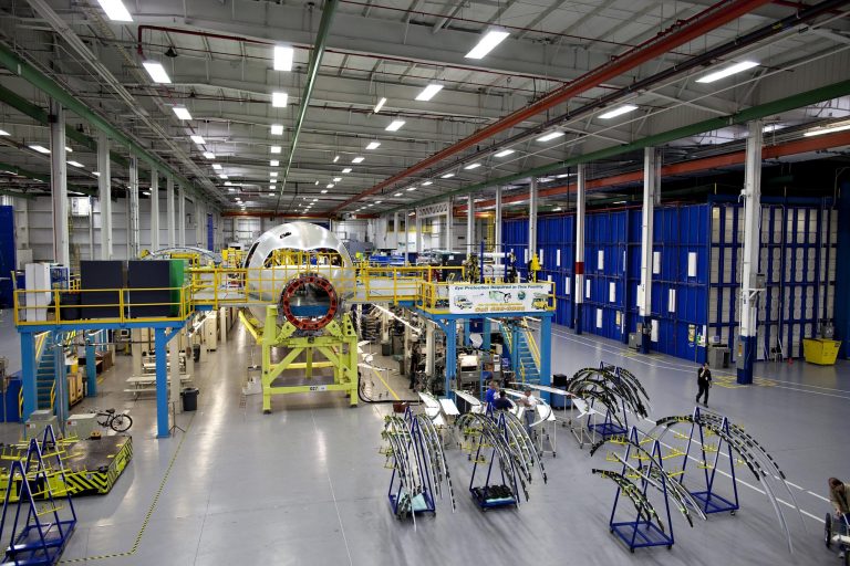 In this 2010 photo, a Boeing 787 composite forward fuselage section sits on the factory floor at Spirit AeroSystems in Wichita, Kansas.