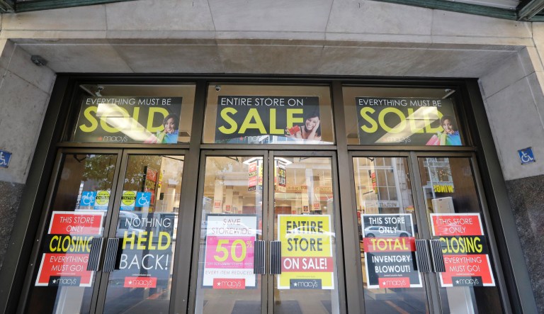 In this photo taken Thursday, Jan. 9, 2020, "store closing" signs fill the windows in a Macy's store in downtown Seattle. The store is one of nearly 30 Macy's stores to be closed nationwide in the coming weeks.