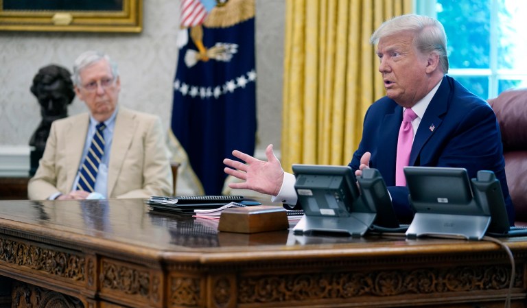 President Donald Trump meets with Senate Majority Leader Mitch McConnell (left) in the Oval Office at the White House in Washington on July 20, 2020.