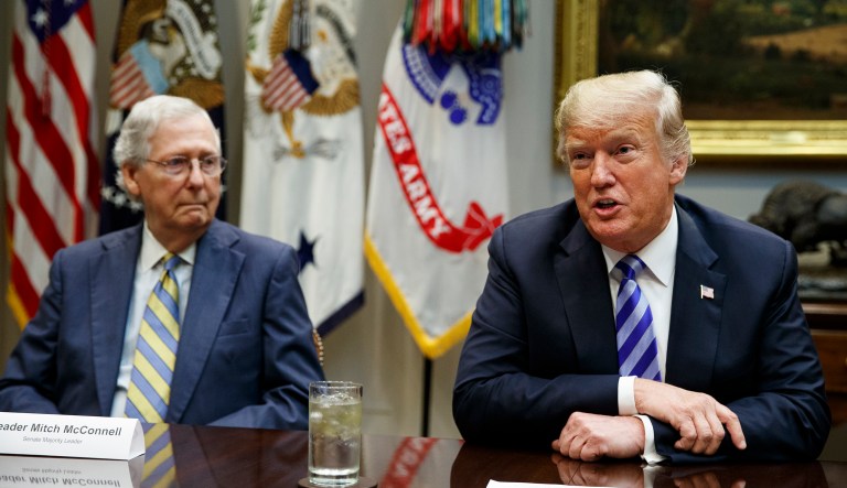 Senate Majority Leader Mitch McConnell, R-Ky., listens as President Donald Trump speaks during a meeting with Republican lawmakers in the Roosevelt Room of the White House, Wednesday, Sept. 5, 2018, in Washington.