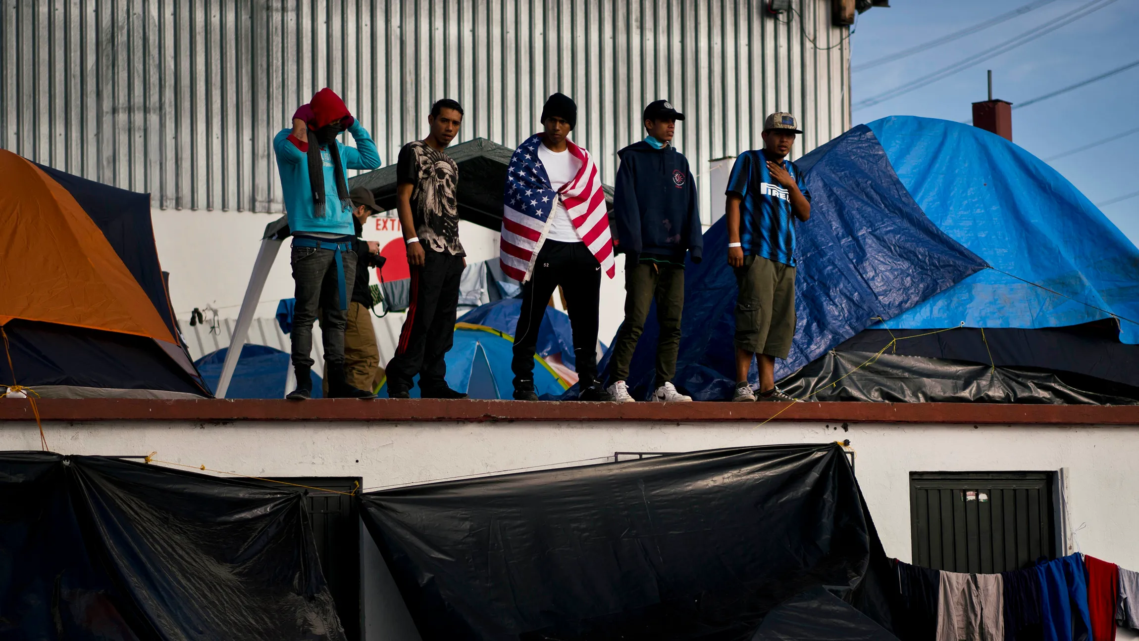 Migrants moved farther from US-Mexico border after Tijuana shelter gets shut down