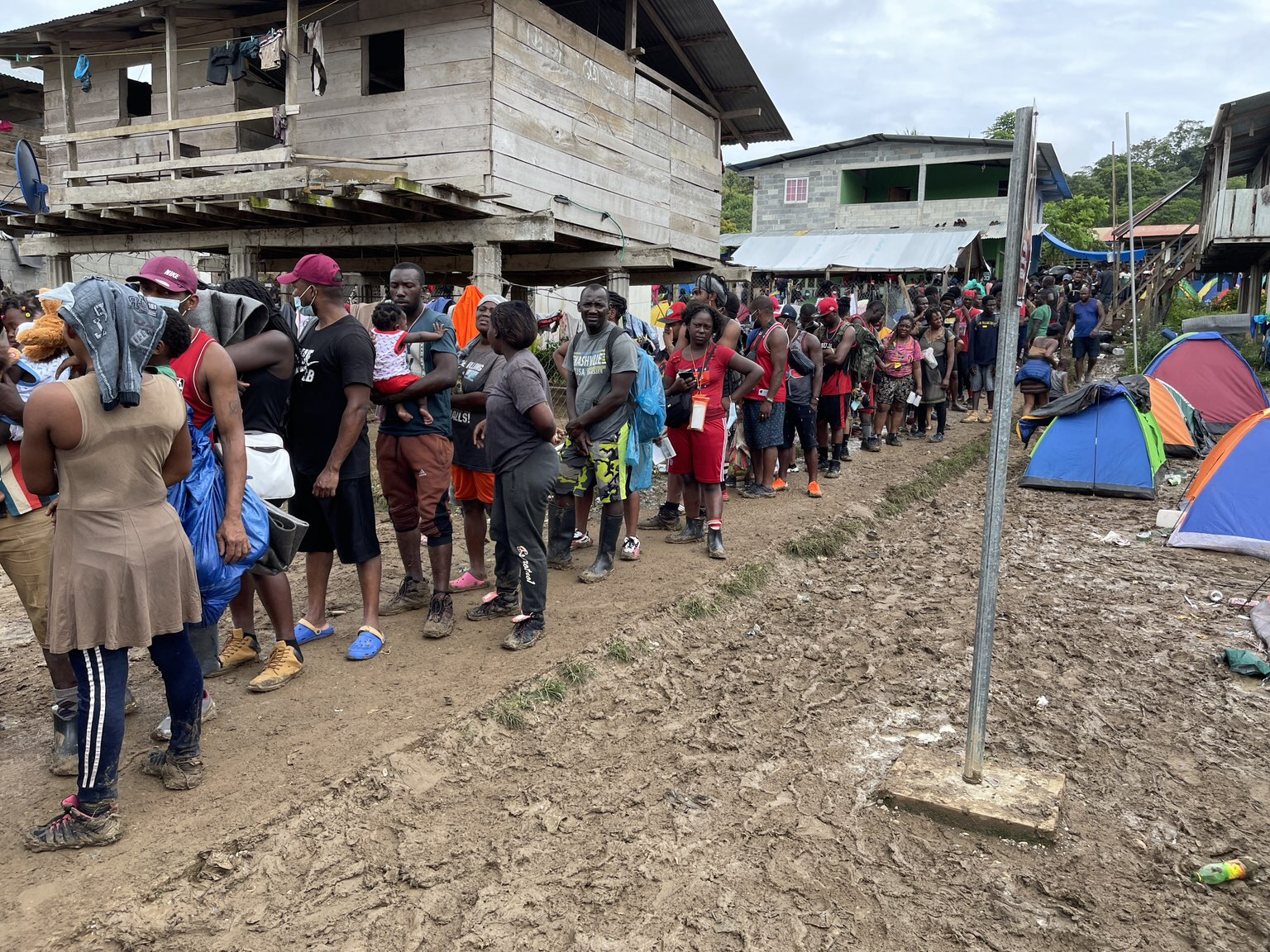 Migrants line up for services at Darien Gap.jpg
