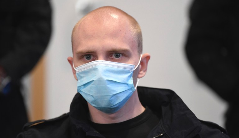 Accused Stephan Balliet sits in the courtroom of the regional court at the beginning of the trial in Magdeburg, Germany, Tuesday, July 21, 2020. The Federal Prosecutor's Office accuses the assassin of Hall 13 of criminal offences, including murder and attempted murder. On 9 October 2019, on the highest Jewish holiday Yom Kippur, he had attempted to cause a bloodbath in the synagogue in Halle.