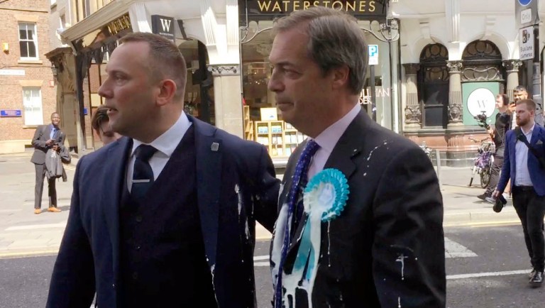 Nigel Farage the leader of Britain's Brexit Party gives a television interview after delivering a letter addressed to "The Prime Minister" asking for the Brexit Party to be included in Brexit negotiations with the European Union (EU) outside 10 Downing Street in London, Friday, June 7, 2019. Farage's Brexit Party came close to winning its first seat in Parliament on Friday, narrowly losing to Labour in a special election in the eastern England city of Peterborough. 