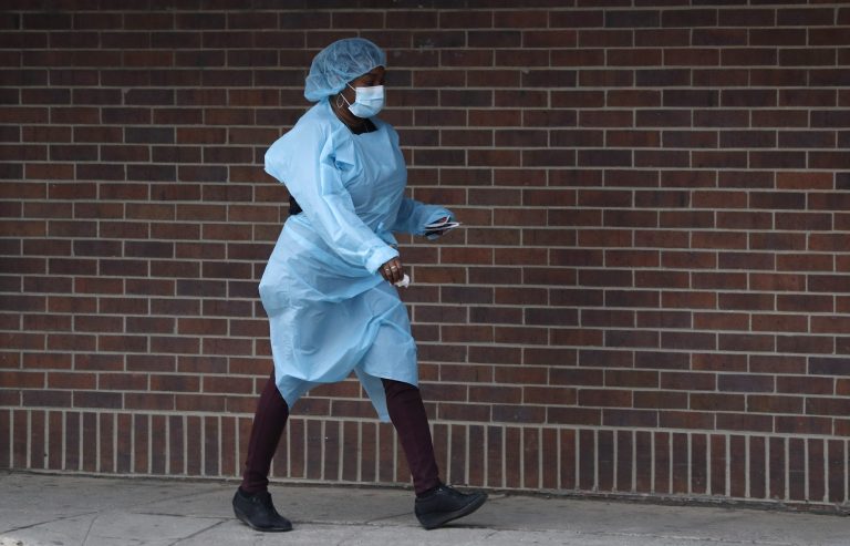 Nurses at Massachusetts hospital go on strike after labor negotiations fall apart A nurse wearing personal protective equipment (PPE) walks toward the emergency room door, Sunday, April 5, 2020, at Brooklyn Hospital Center in New York. Located in downtown Brooklyn, the public hospital is one of several in New York city treating high numbers of coronavirus cases during the current viral pandemic. The new coronavirus causes mild or moderate symptoms for most people, but for some, especially older adults and people with existing health problems, it can cause more severe illness or death.