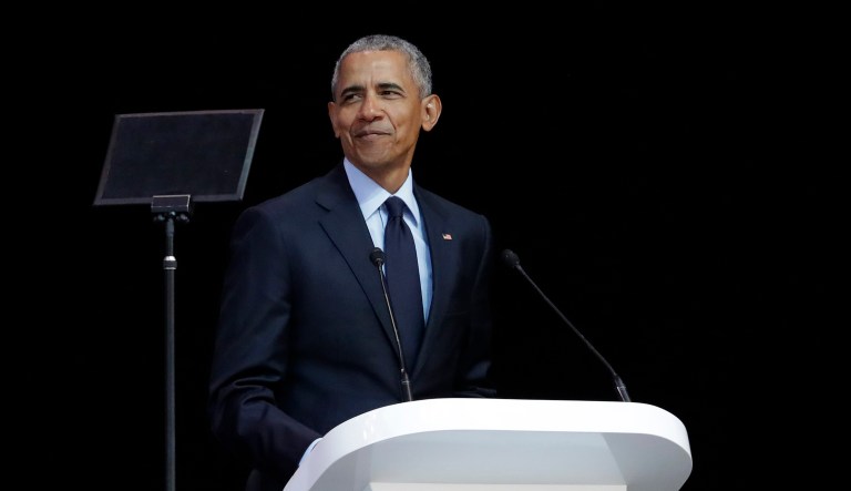Former U.S. President Barack Obama, left, delivers his speech at the 16th Annual Nelson Mandela Lecture at the Wanderers Stadium in Johannesburg, South Africa, Tuesday, July 17, 2018. In his highest-profile speech since leaving office, Obama urged people around the world to respect human rights and other values under threat in an address marking the 100th anniversary of anti-apartheid leader Nelson Mandela's birth.