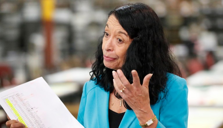 Palm Beach County Supervisor Of Elections Susan Bucher gestures as she holds up a tally sheet while speaking to members of the media at the Supervisor of Elections office after the deadline for a recount was reached, Thursday, Nov. 15, 2018, in West Palm Beach, Fla.