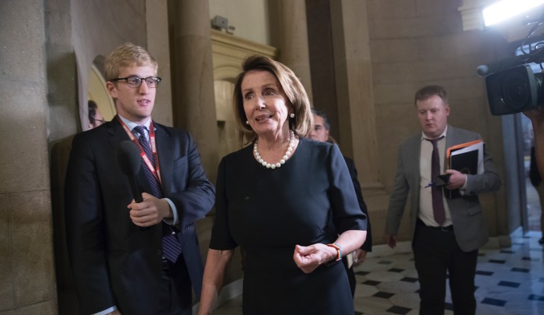 House Minority Leader Nancy Pelosi, D-Calif., leaves a meeting with Speaker of the House Paul Ryan, R-Wis., and and members of the Congressional Hispanic Caucus at the Capitol in Washington. 