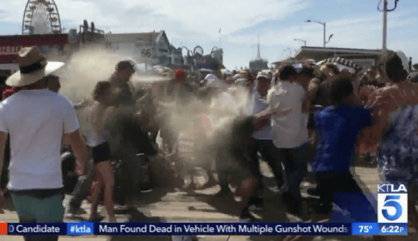 Man wearing MAGA hat arrested for dousing anti-Trump demonstrators with bear spray