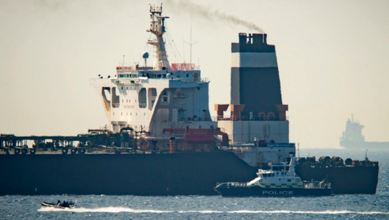 Royal Marine patrol vessel is seen beside  the Grace 1 super tanker in the British territory of Gibraltar, Thursday, July 4, 2019. Authorities in Gibraltar said they intercepted Thursday an Iranian supertanker believed to be breaching European Union sanctions by carrying a shipment of Tehran's crude oil to war-ravaged Syria. 