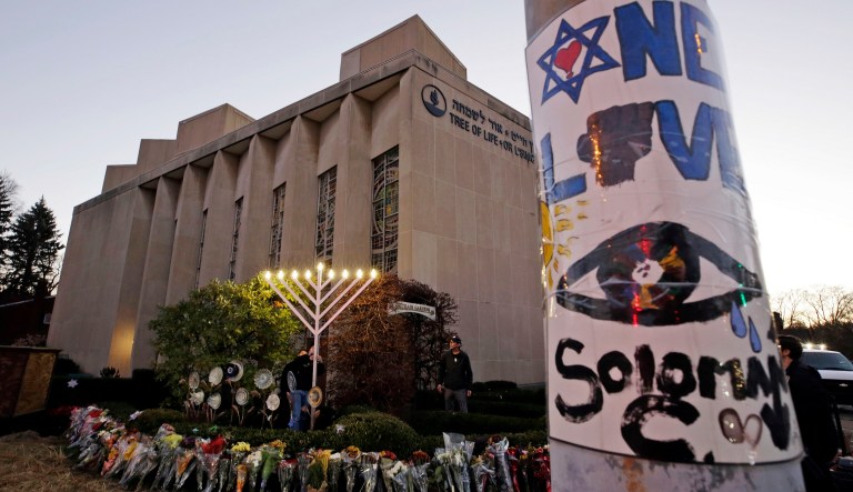 A menorah is tested outside the Tree of Life Synagogue in preparation for a celebration service at sundown on the first night of Hanukkah, Sunday, Dec. 2, 2018 in the Squirrel Hill neighborhood of Pittsburgh.
