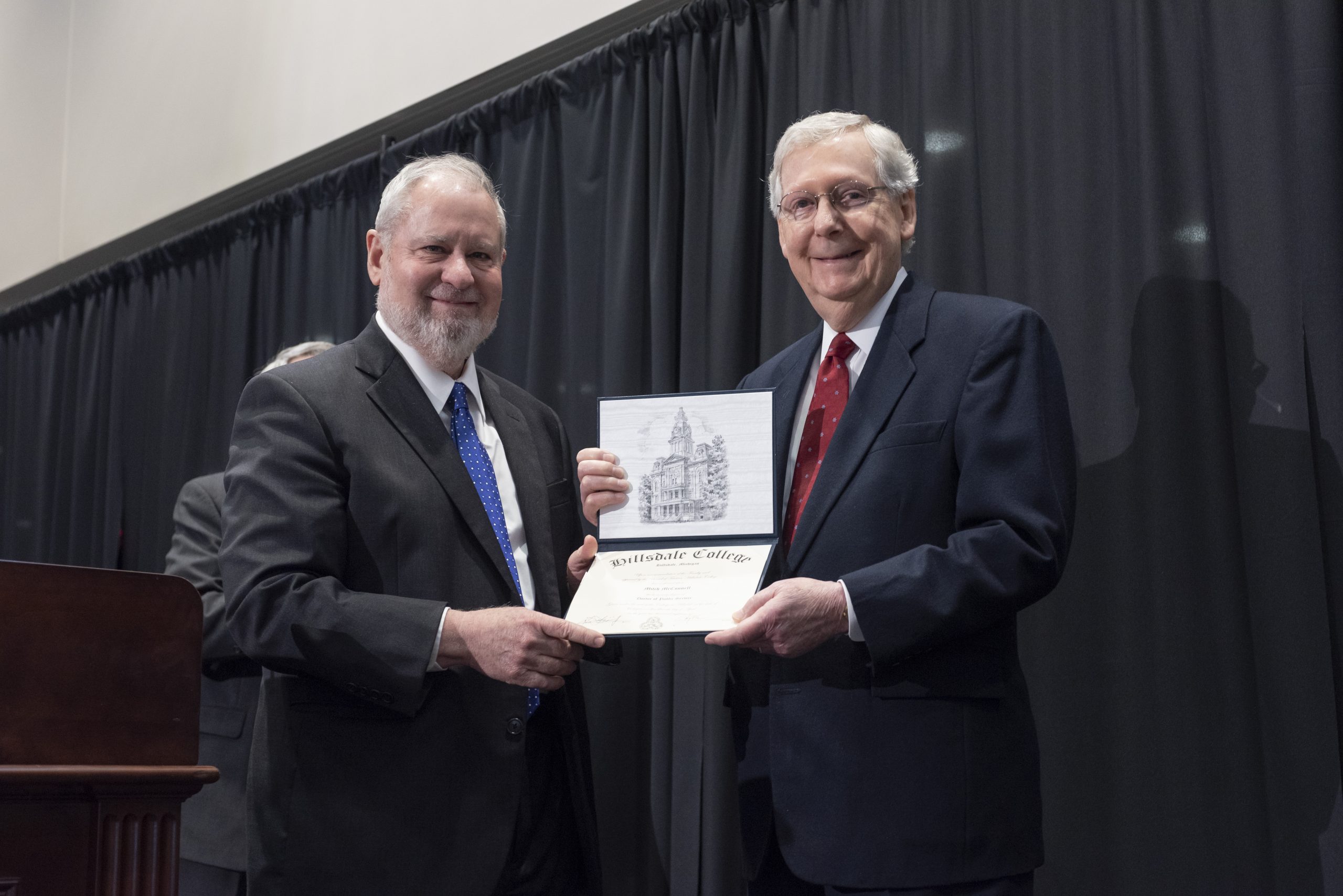 Hillsdale College President Larry P. Arnn presents an honorary doctorate of public service to Senate Majority Leader Mitch McConnell.