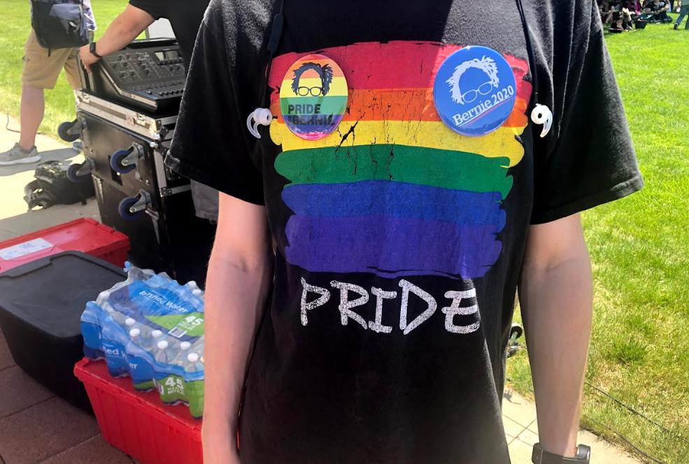 Jonathan Martin wearing a pride shirt decorated with Bernie Sanders buttons