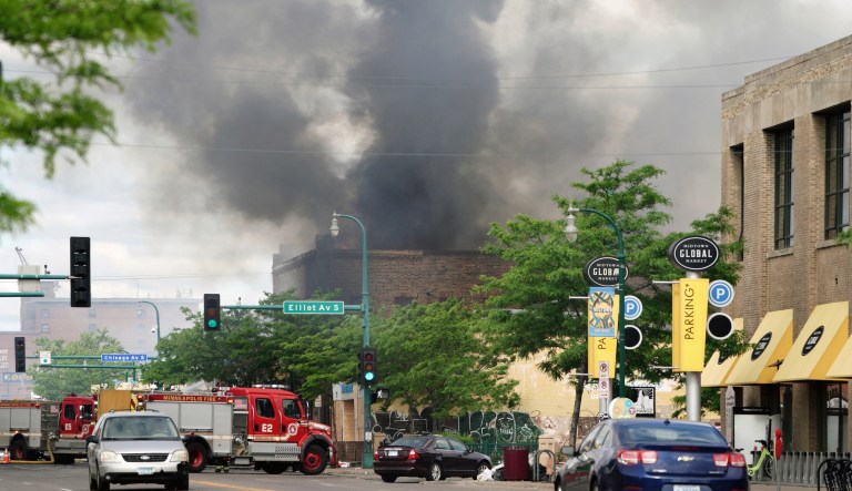 The Foot Locker Store and the apartments above it burn along Lake Street Friday morning. Minneapolis residents awoke Friday to assess the damage after a second night rioters ignited fires and looted stores all over the city, as peaceful protests turned increasingly violent in the aftermath the death of George Floyd during an arrest. Buildings on Lake Street were still burning Friday morning.