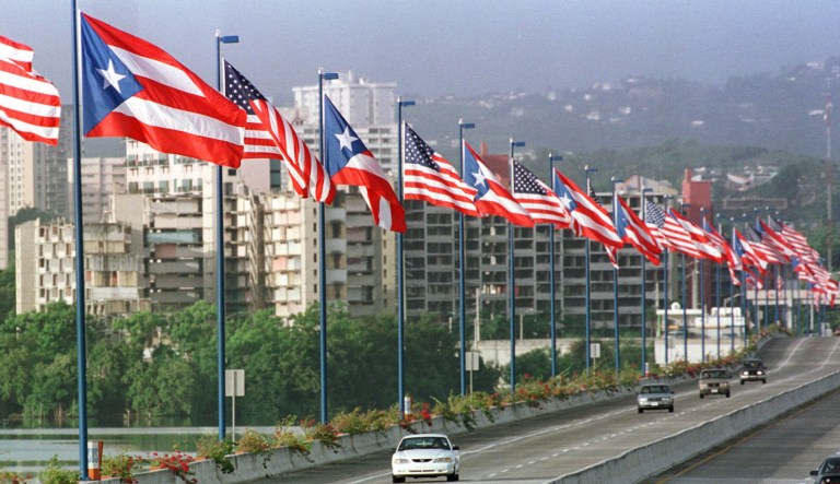 Puerto Rican and American flags line the Moscoso bridge in San Juan, P.R., July 5, 1998, symbolically linking the United States and its Spanish-speaking commonwealth.