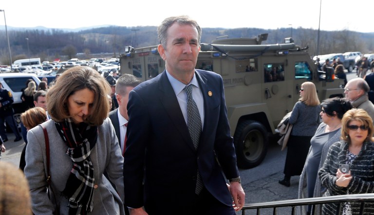 Virginia Gov. Ralph Northam, left, and his wife Pam, left, leave the funeral of fallen Virginia State Trooper Lucas B. Dowell after the church service for the funeral at the Chilhowie Christian Church in Chilhowie, Va., Saturday, Feb. 9, 2019. Dowell was killed in the line of duty earlier in the week.
