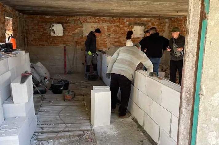 Pastor Joel Brown is working with other Ukrainian men to renovate a garage to be a long-term housing solution for refugees.
