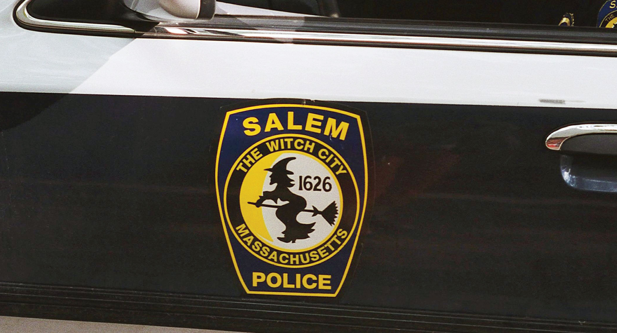 A Salem police car bearing the city emblem.
