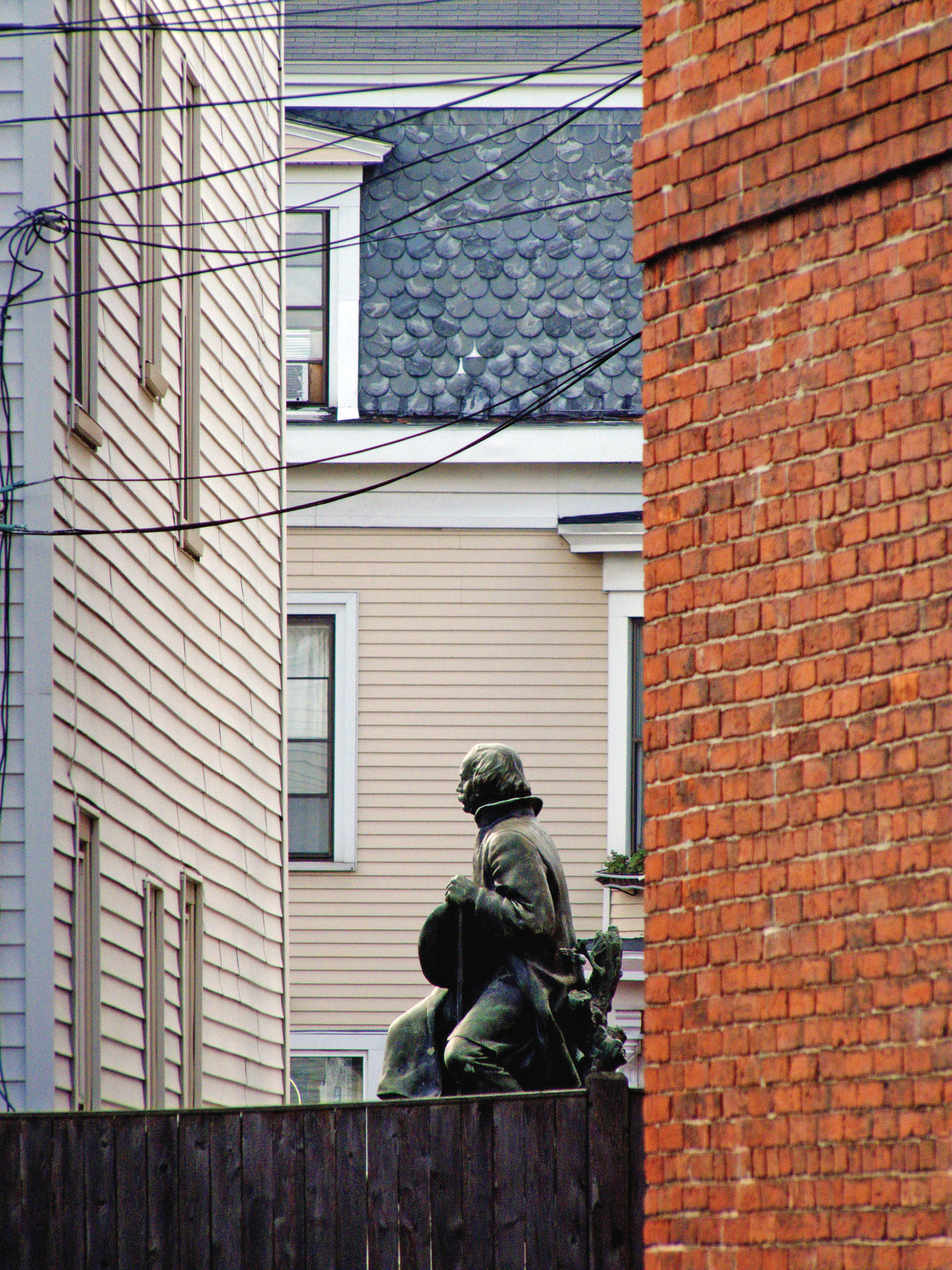 Bela Pratt’s 1917 statue of Nathaniel Hawthorne, with Fatima’s Psychic Studio in the background.