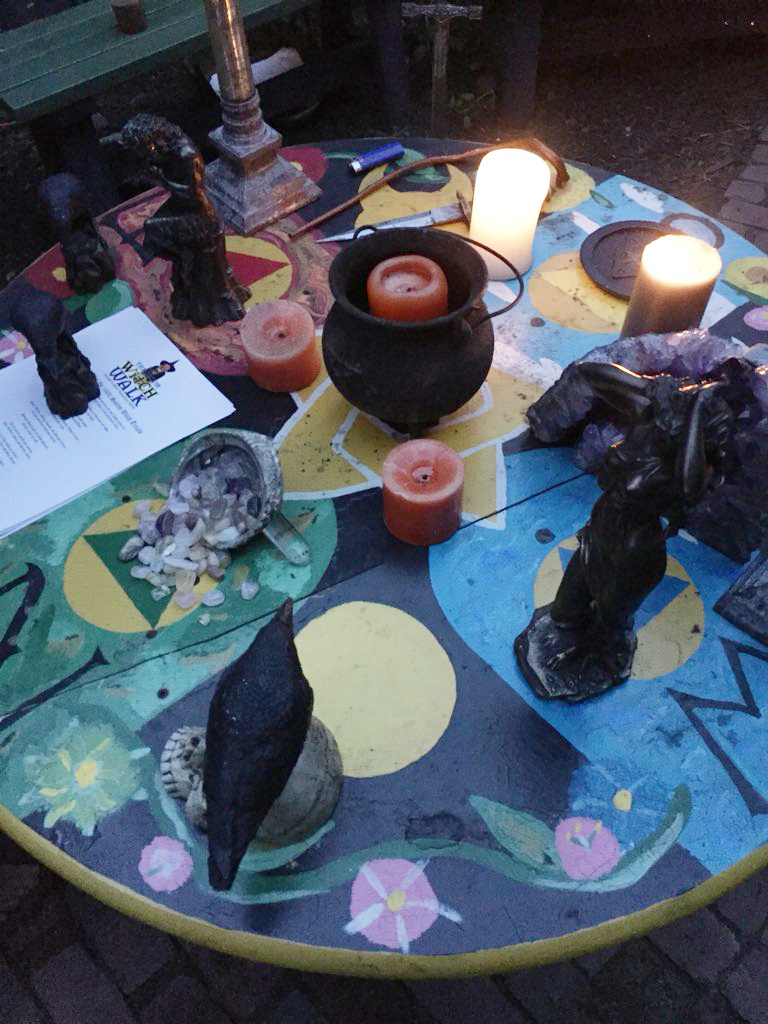 Candles, crystals, and a stuffed crow set the mood for the “witch walks” offered by Crow Haven Corner.