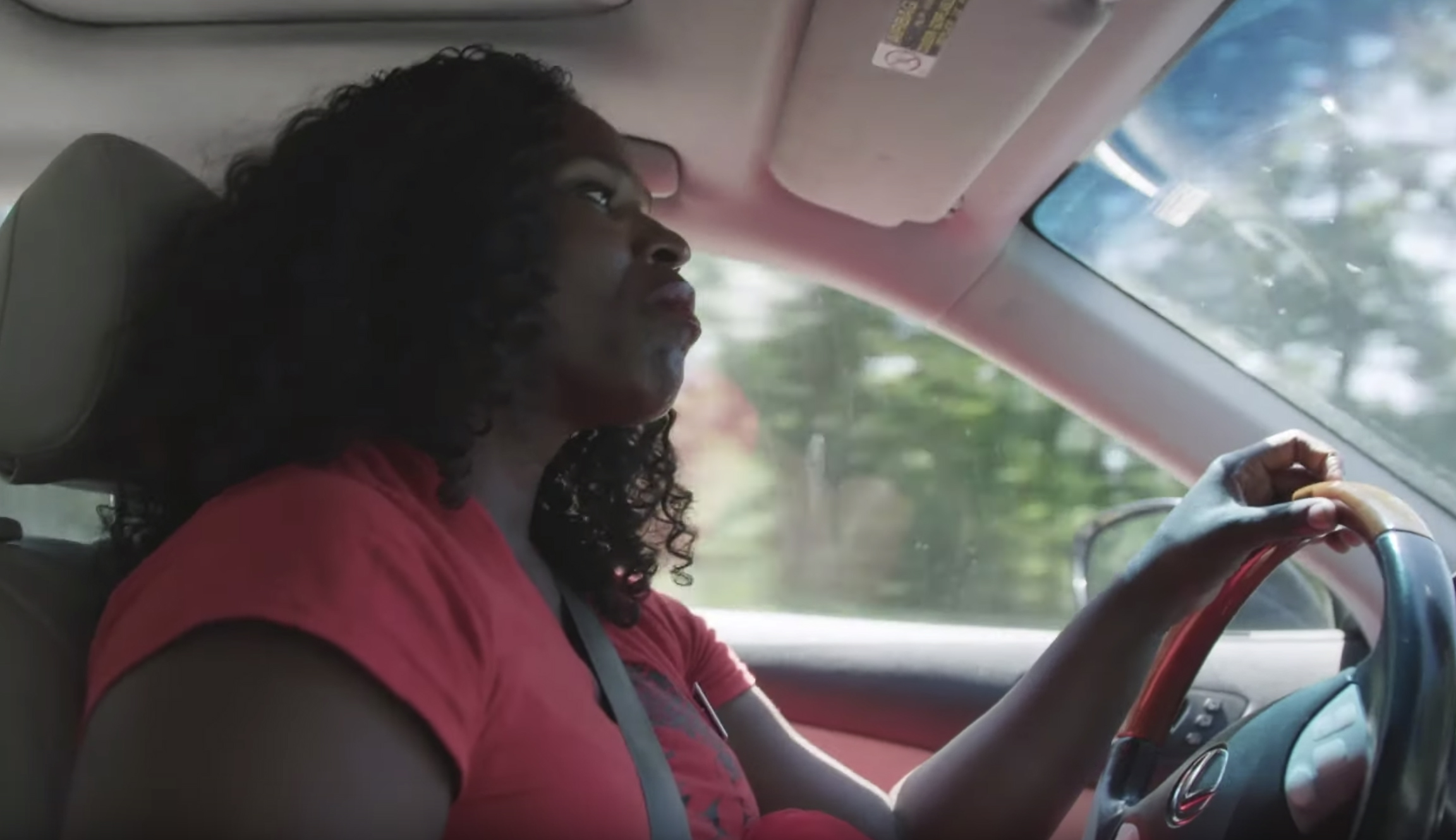 Warren ad highlighting middle-class struggles features woman driving Lexus