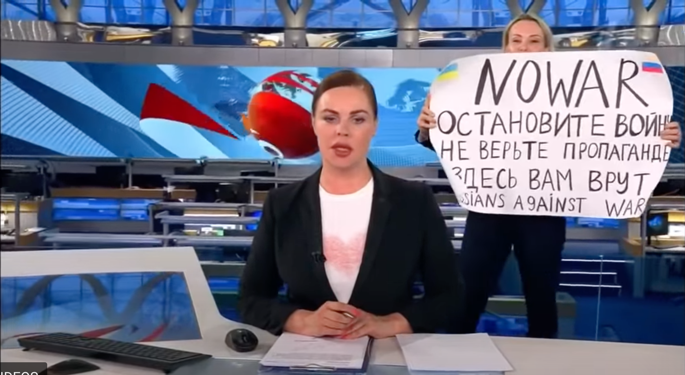 ‘Lying to you’: Russian TV employee interrupts news broadcast with anti-war sign
