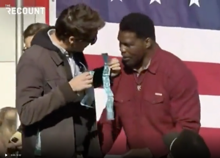 Comedian trolls Herschel Walker with gift of condoms at Senate campaign event
