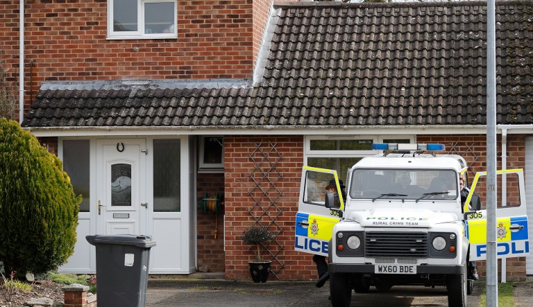 A police vehicle is parked outside the house of former Russian double agent Sergei Skripal who was found critically ill Sunday following exposure to an "unknown substance" in Salisbury, England, Tuesday, March 6, 2018. Skripal, and an unidentified woman companion are being treated in hospital, after they were found unconscious on a  bench in the town.