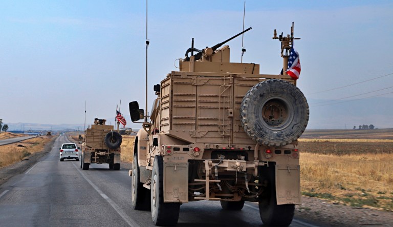 A U.S. military convoy arrives near Dahuk, Iraqi, Monday, Oct. 21, 2019.