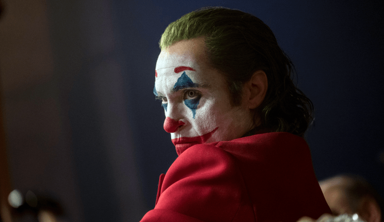 This image released by Warner Bros. Pictures shows Joaquin Phoenix in a scene from the film "Joker." (Niko Tavernise/Warner Bros. Pictures via AP)